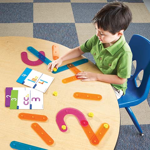Preschool boy playing with Number Construction