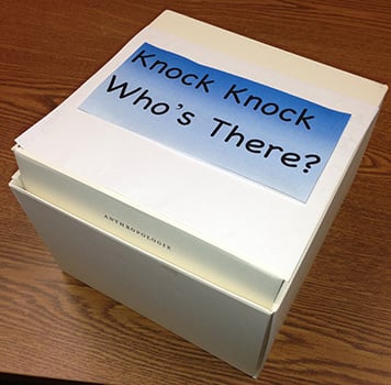White box with Knock Knock Whose There written on it