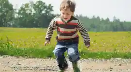 Preschool child running in the park