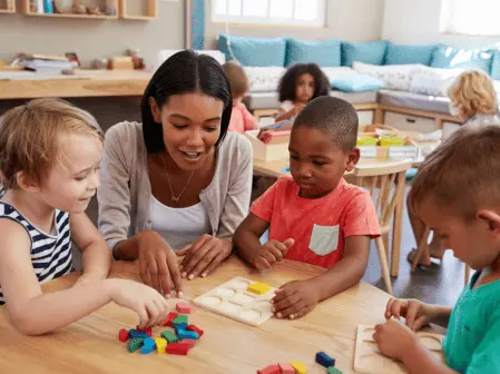 Toddler child standing at family board photos