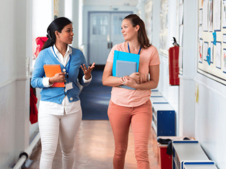 teachers walking alongside each other