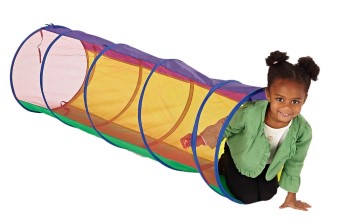 Preschool girl climbing out end of mesh tunnel