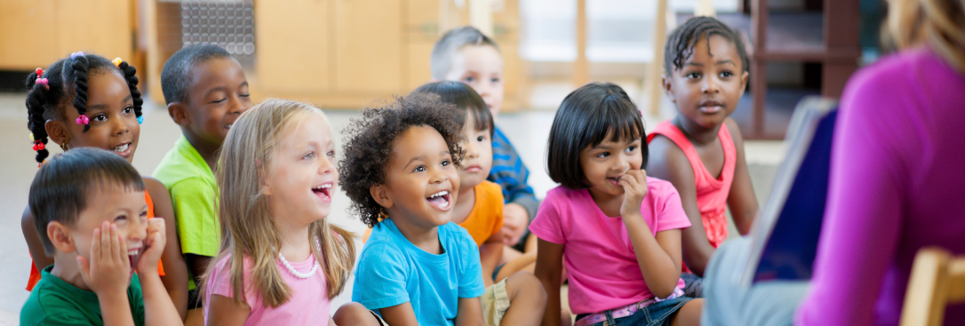 Preschool children laying on a rug