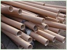 Large pile of cardboard tubes