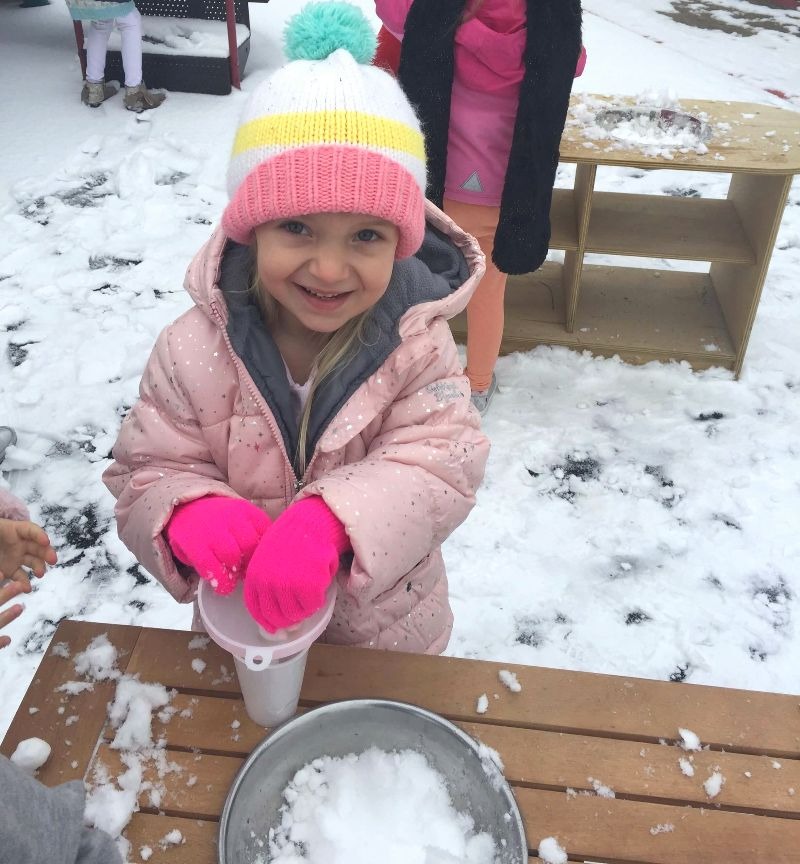 preschool outdoor play in winter with mud kitchens