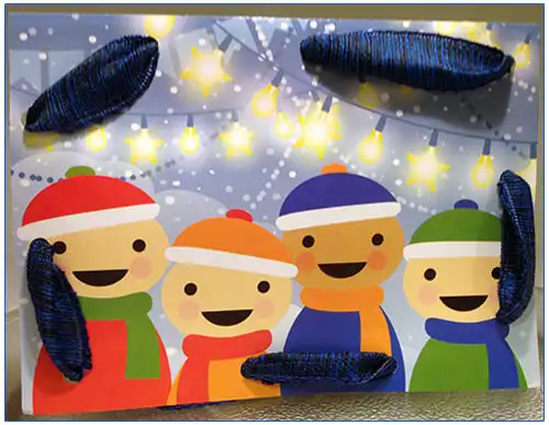 Holiday cards with blue and yellow ribbon laced around the edges