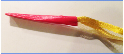 Yellow ribbon with tape on the tip for lacing
