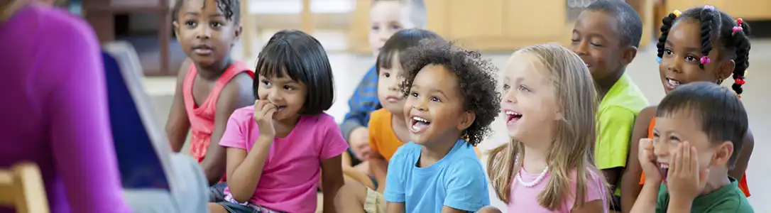 Children and teachers actively engaged in a classroom