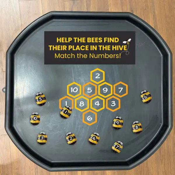 Bee-themed tuff tray activity that supports counting and number recognition.
