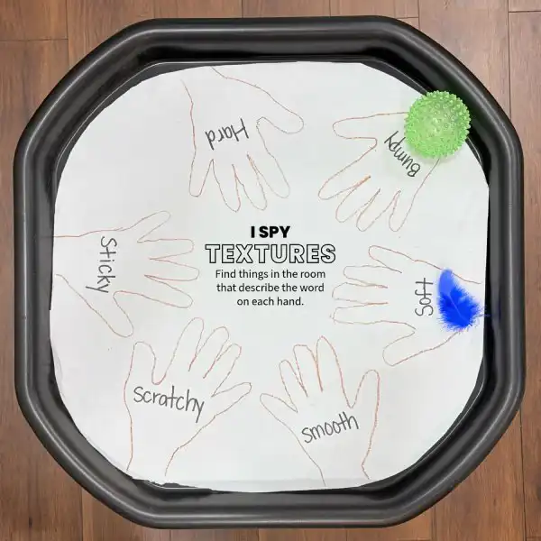 Sensory tuff tray activity exploring different classroom textures and materials.