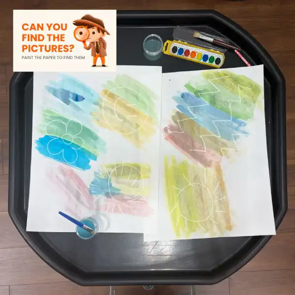 Watercolor tuff tray activity that encourages creativity and fine motor skills.