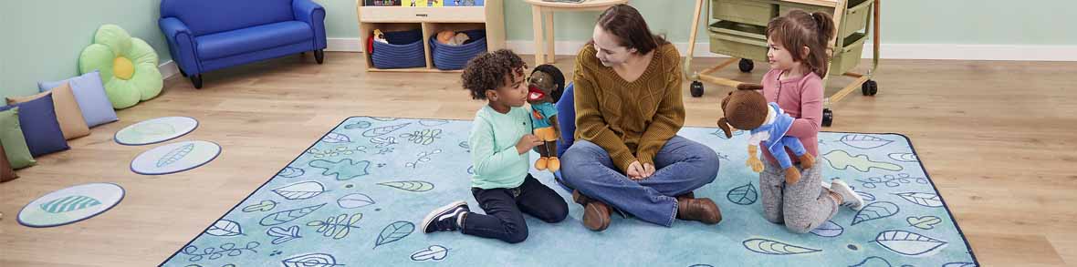 Preschool children & teacher sitting on a Carpets for Kids Rug