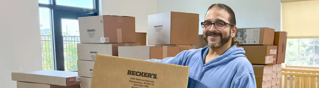 ​​man delivering school supplies for early learning classroom setup​