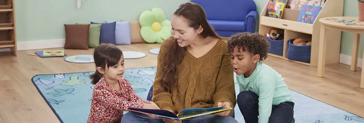Preschool teacher & children reading