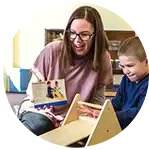 ​​Preschool boy and teacher using STEM Ramp Set​ 