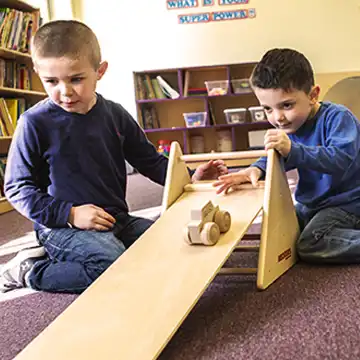 Preschool boys using beckers stem ramp 