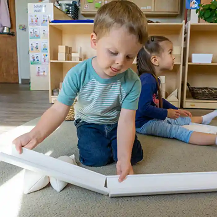 Toddler playing with Kodo Toddler Ramp Set