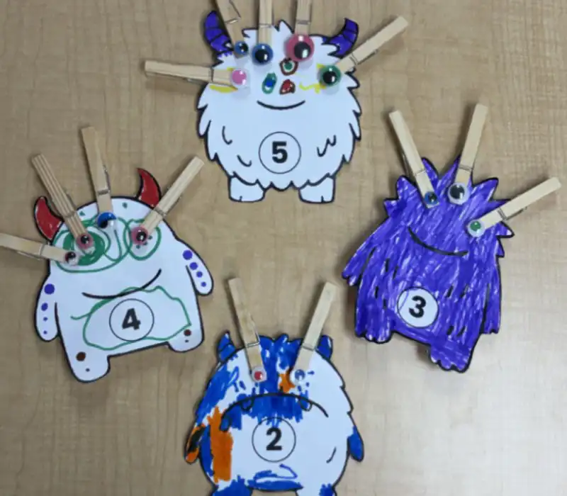 Colorful paper craft monsters with numbers for math activity