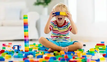 preschool child playing with blocks