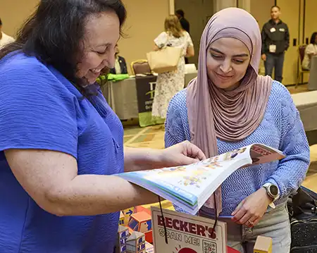 Becker’s Sales Specialist showing catalog and sharing product expertise