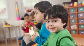 young children playing instruments in a classroom