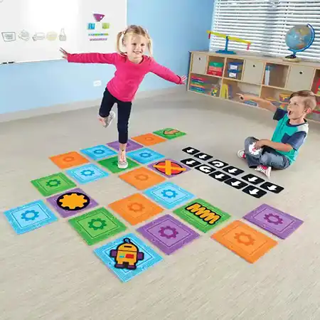 Kids playing coding hopscotch