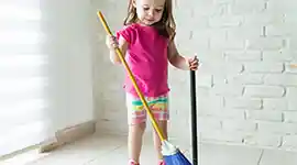young children sweeping