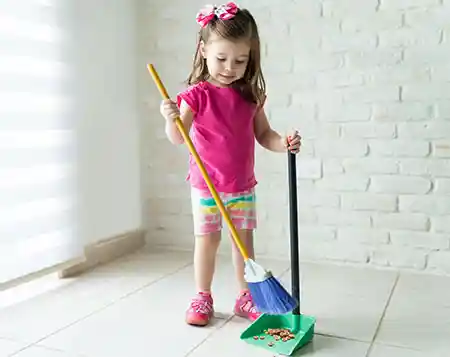 young children sweeping