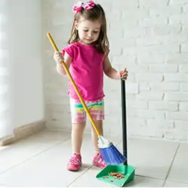 Toddler child standing at family board photos